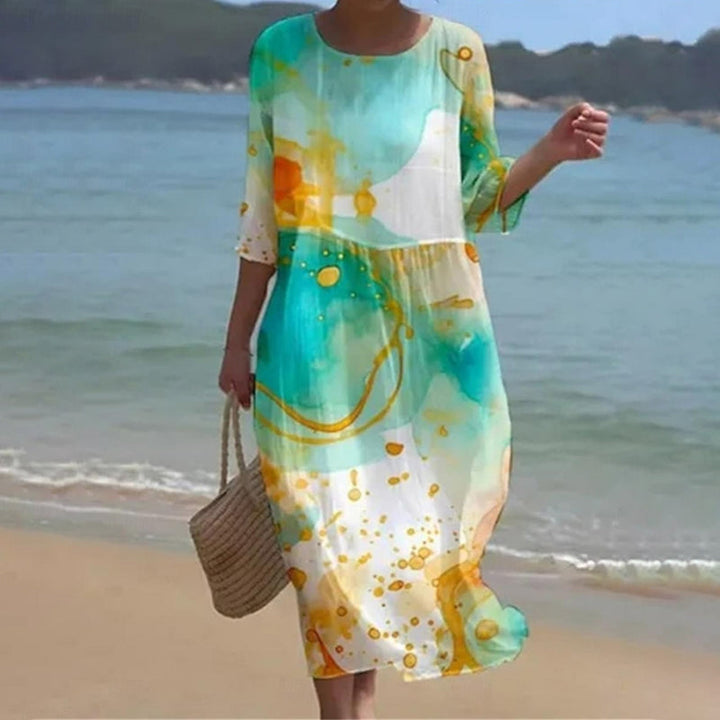 Lange strandjurk met abstracte print voor een luchtige zomerse uitstraling