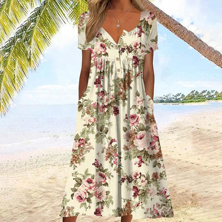 Zomerse midi damesjurk met korte mouwen en bloemenpatroon