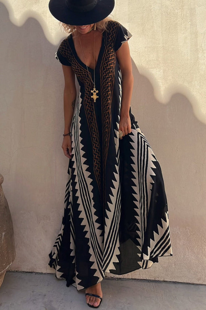 Zomerse maxi jurk met korte mouwen en opvallend patroon voor een elegante uitstraling