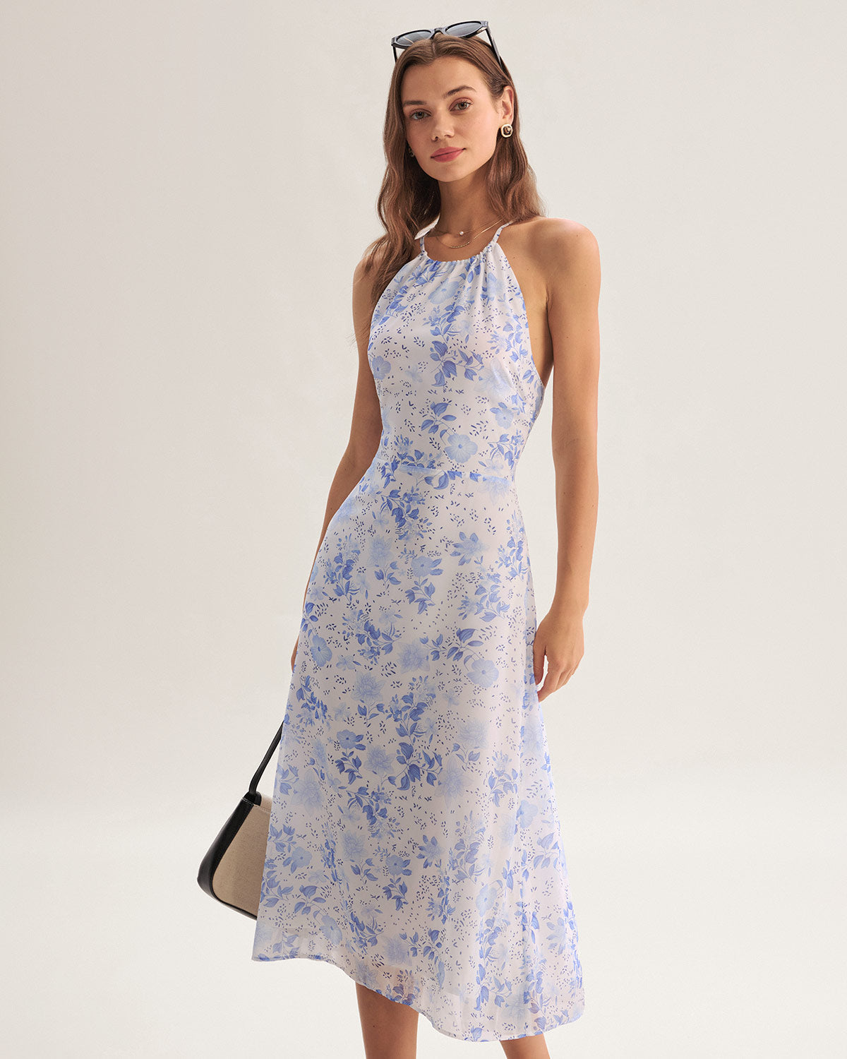 Elegante halterjurk met bloemenmotief en middellange lengte