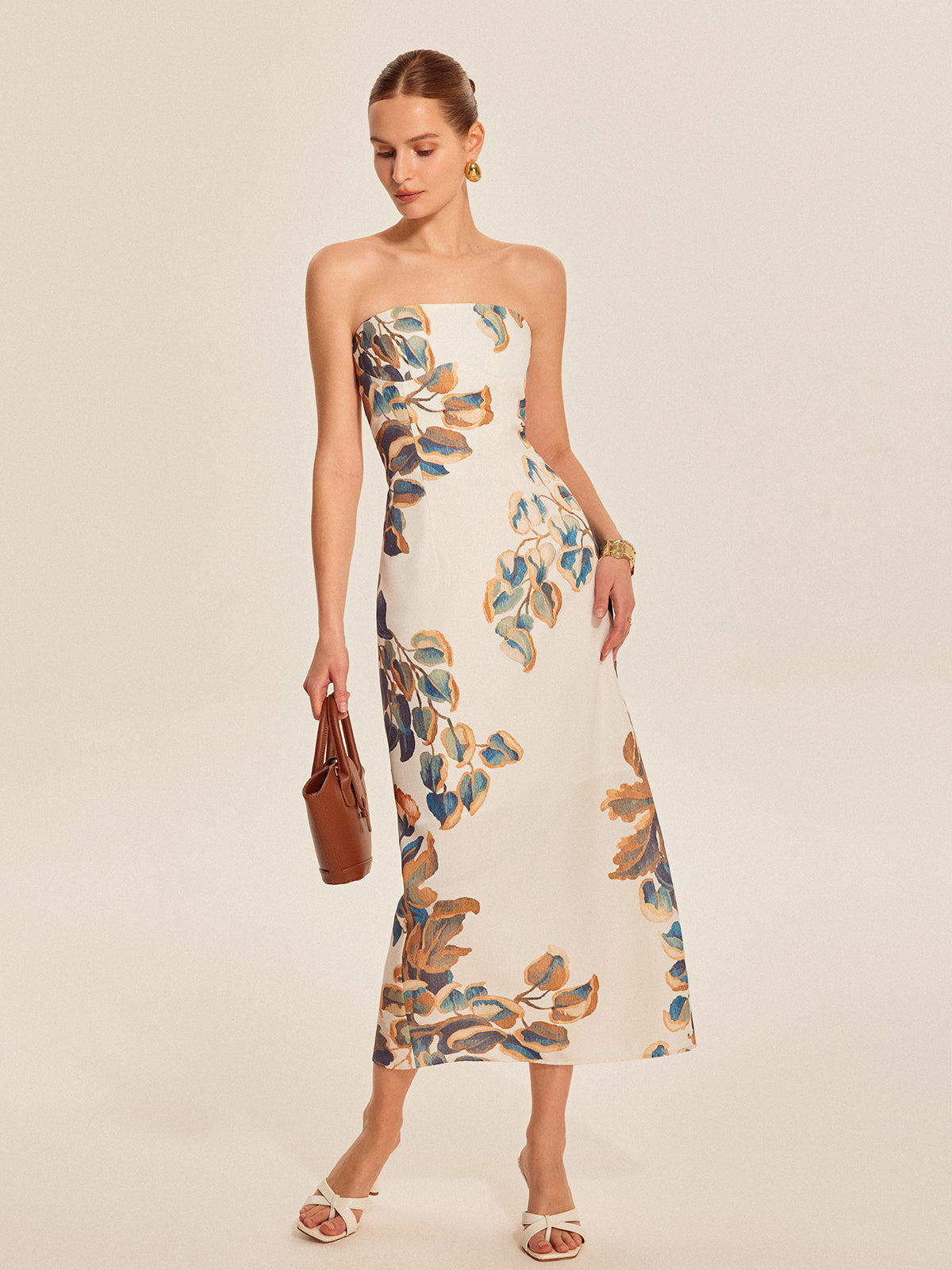 Elegante strapless jurk met bloemenmotief en verfijnde uitstraling