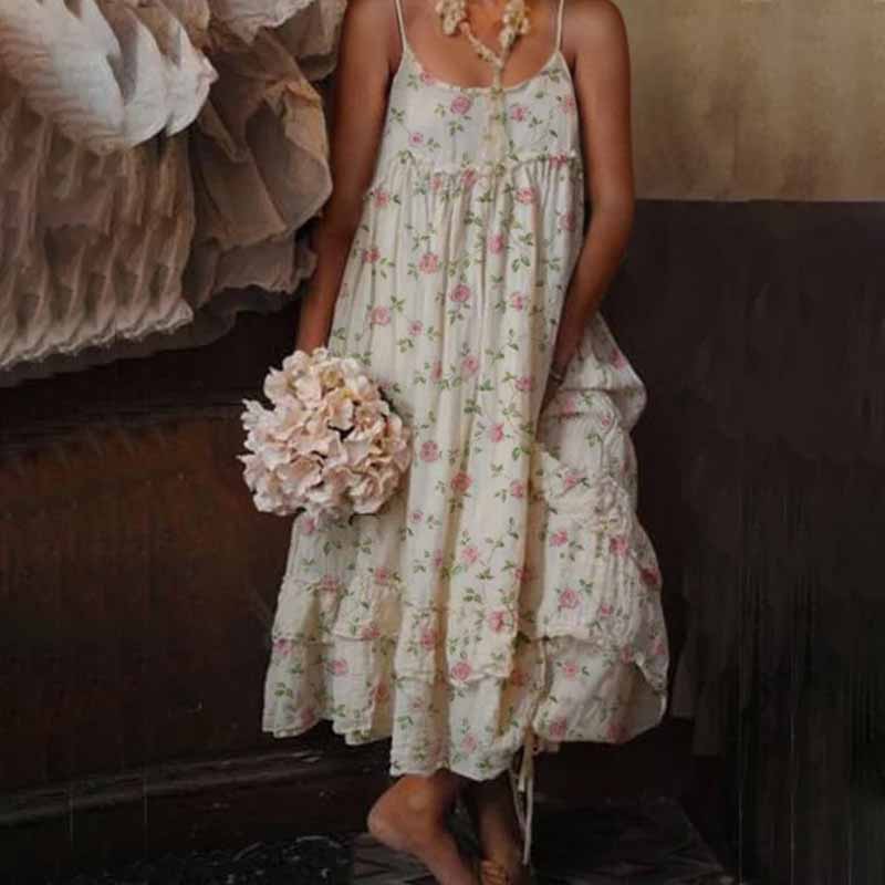 Lange elegante jurk met dunne bandjes en subtiel bloemenmotief