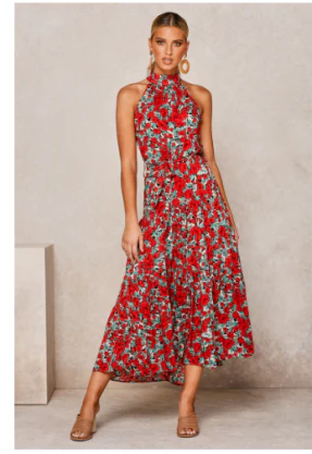 Modieuze damesjurk met bloemenprint haltertop en midi lengte