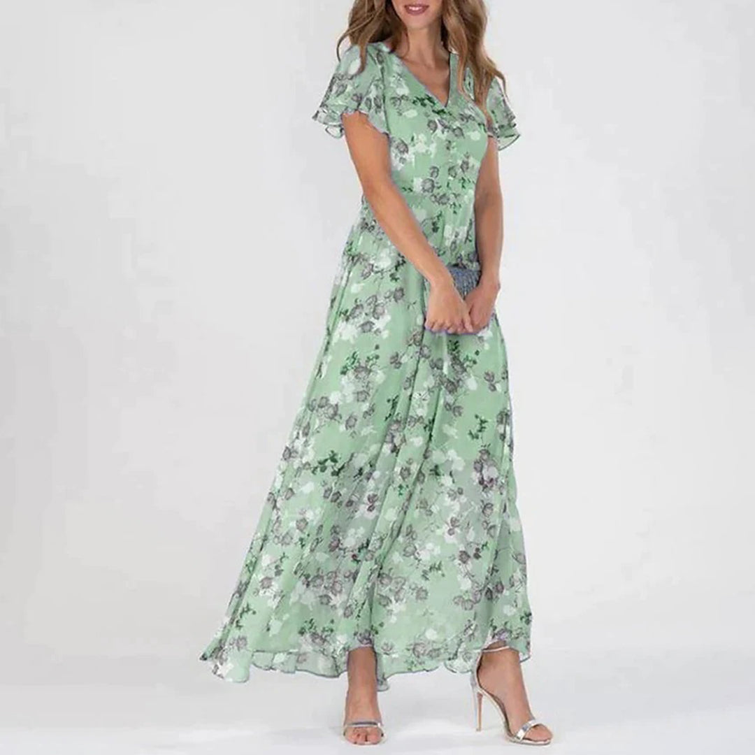 Lange damesjurk met bloemenprint en korte vlindermouwen voor een romantische zomerlook