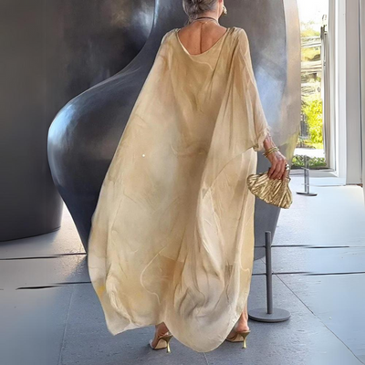 Lange elegante jurk met wijde mouwen en sierlijk patroon