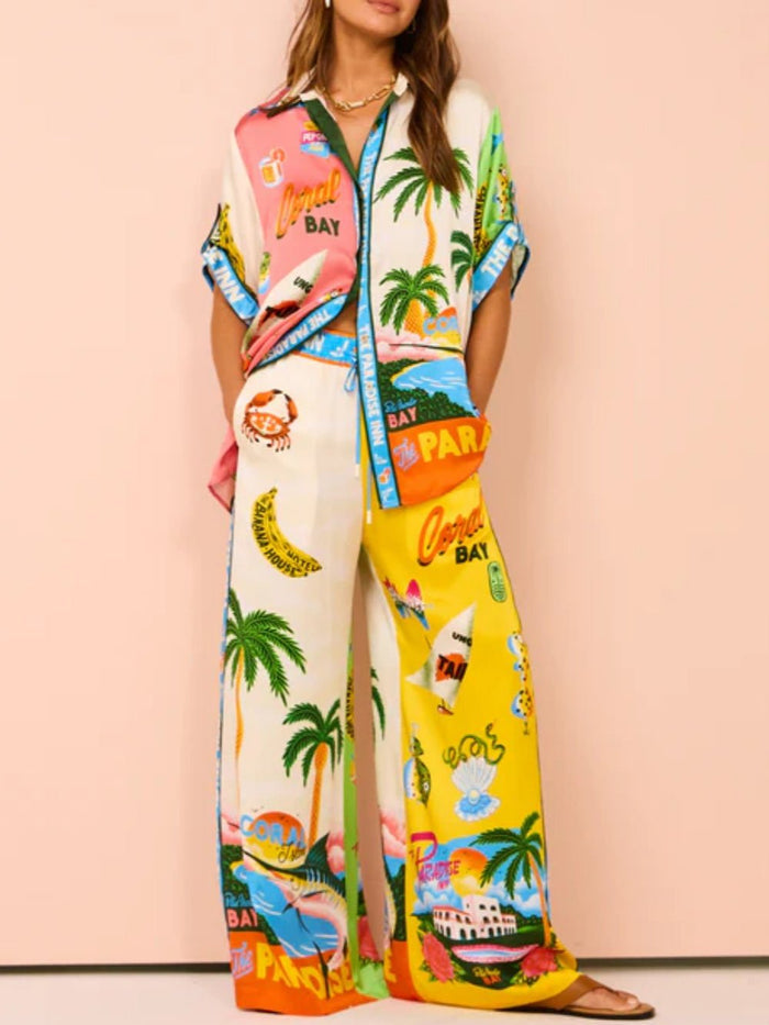 Tweedelige zomerset met wijde blouse en broek met strandprint