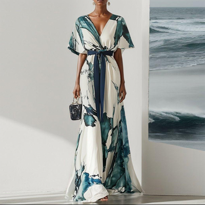 Elegante maxi-jurk met korte wijde mouwen en strikdetail in de taille voor een verfijnde uitstraling