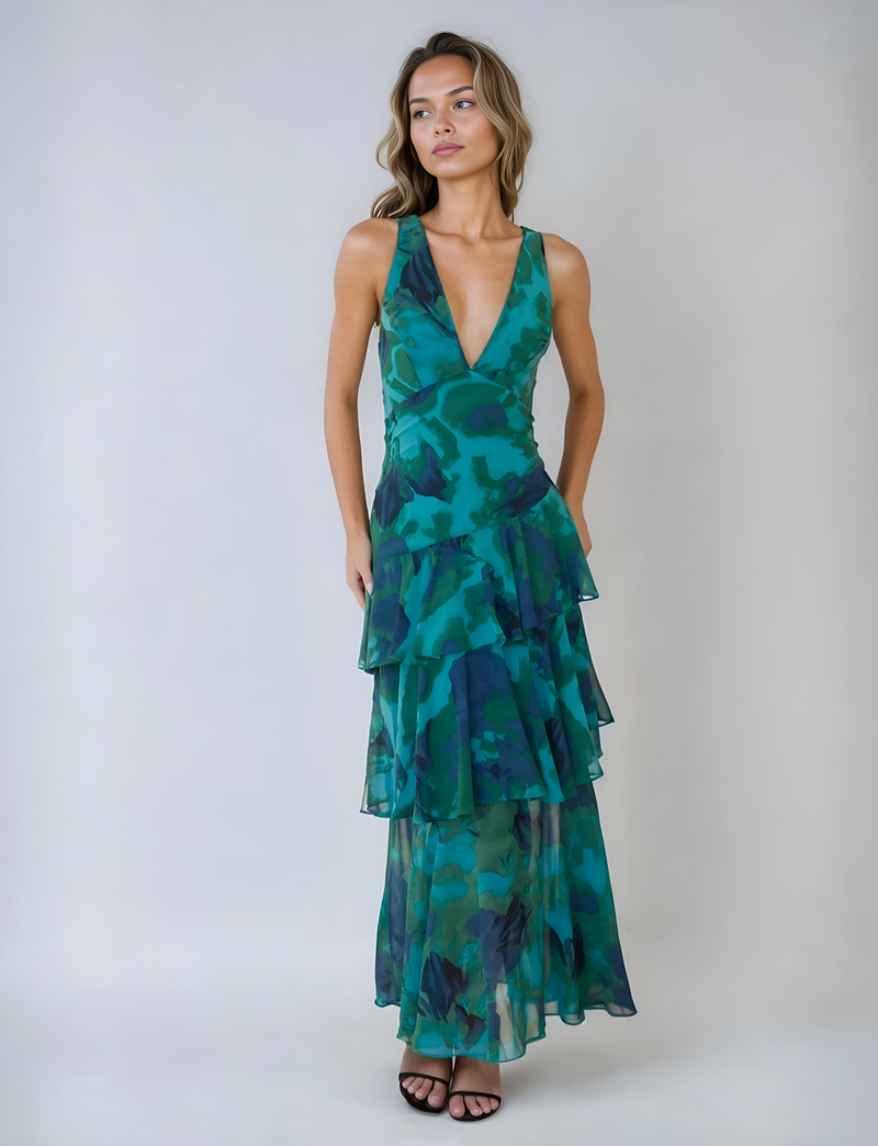 Elegante mouwloze maxi jurk met halterstijl en speelse volantdetails