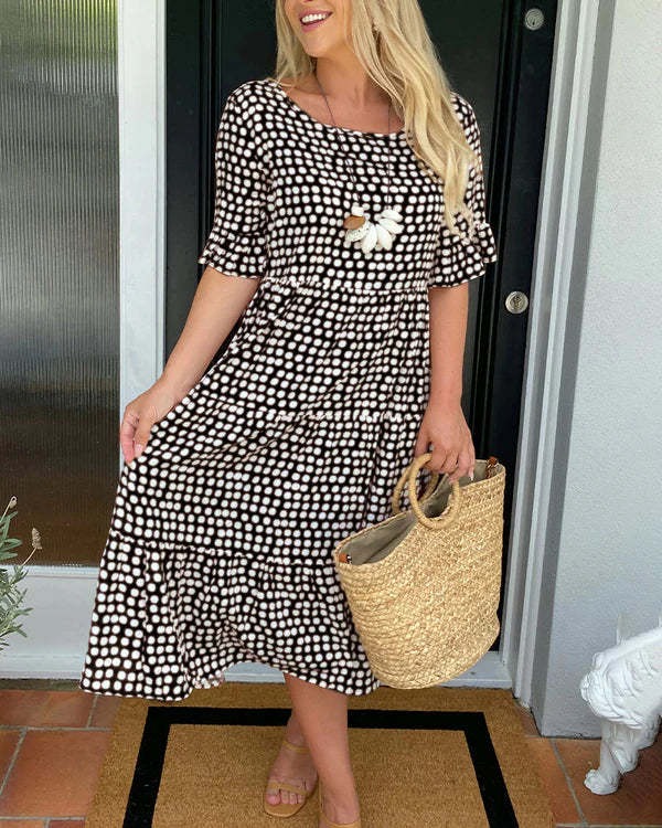Casual midi jurk met stippenprint en speelse volantafwerking