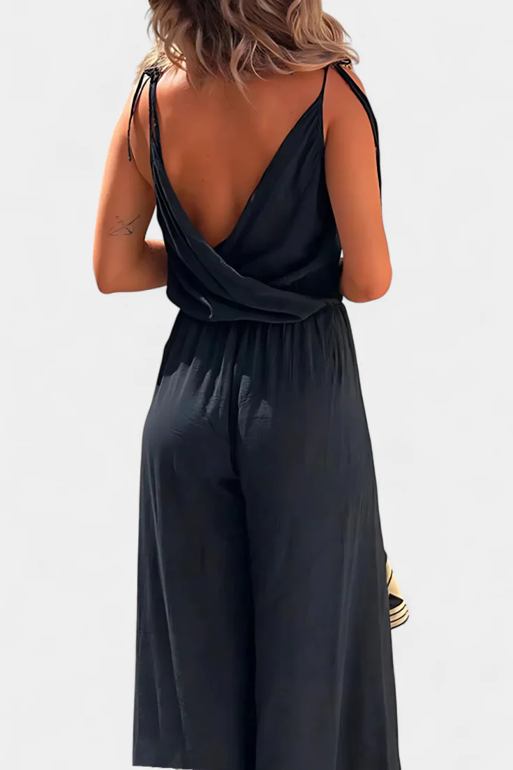 Lange luchtige jumpsuit met smalle bandjes diepe halslijn en open pijpen