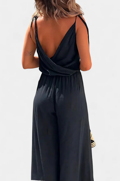 Lange luchtige jumpsuit met smalle bandjes diepe halslijn en open pijpen