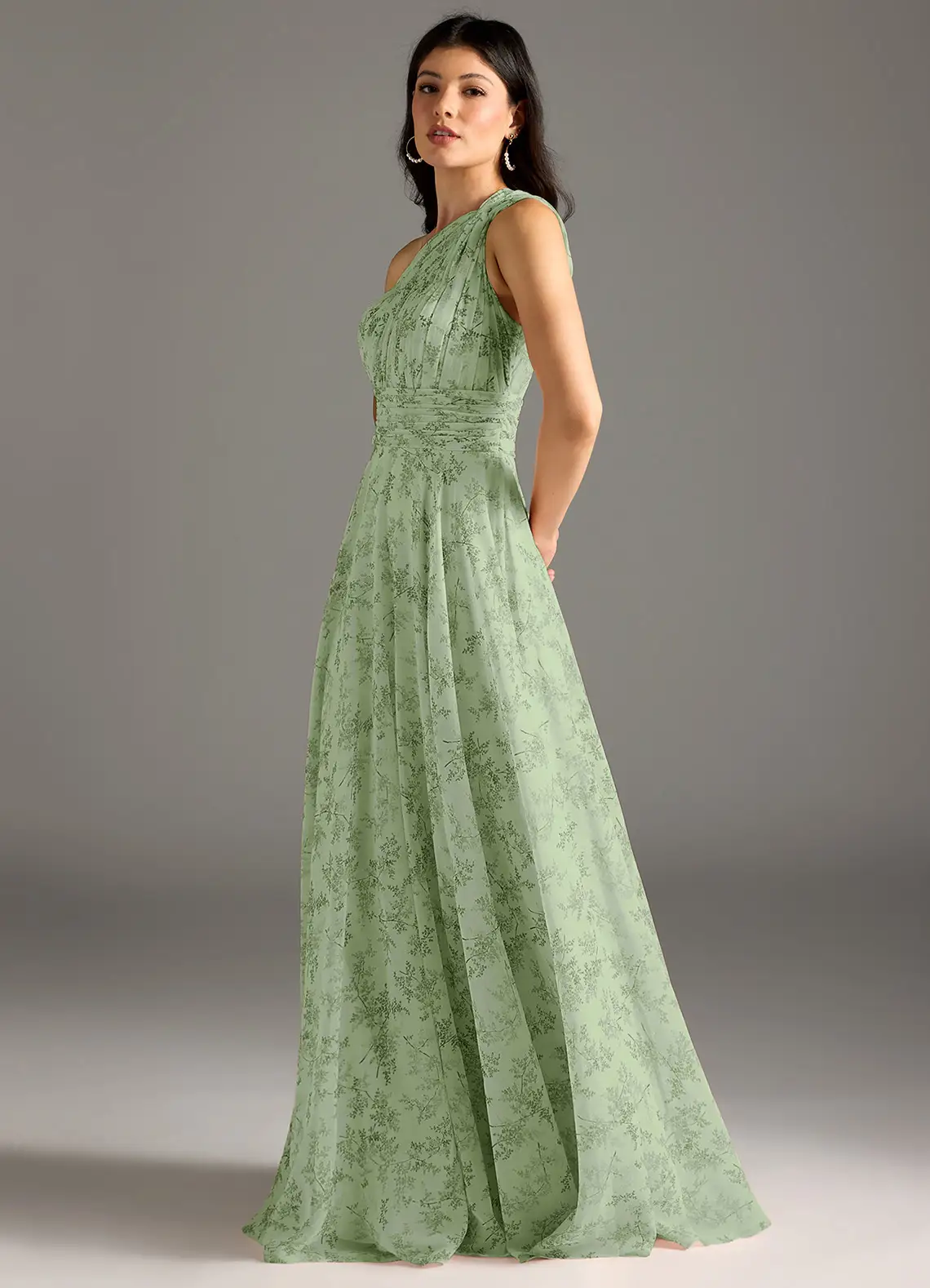 Elegante lange damesjurk met asymmetrische halslijn en bloemendessin