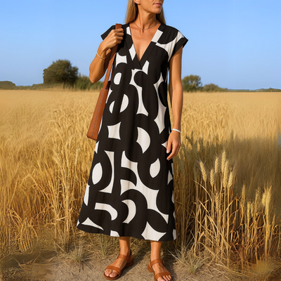 Elegante mouwloze maxi jurk met geometrische print en v hals