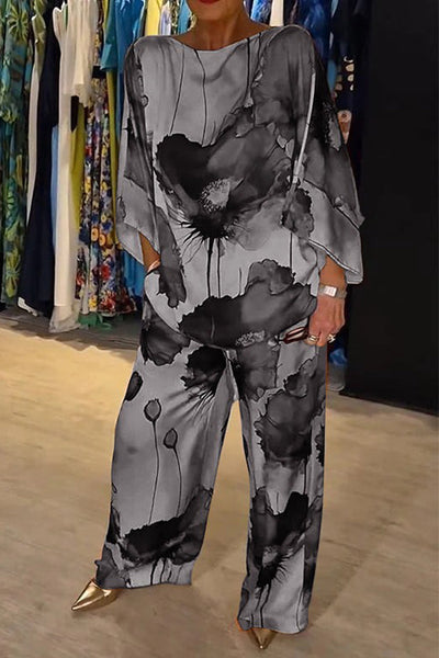 Elegante dames set met wijde blouse en bijpassende broek voor een stijlvolle uitstraling