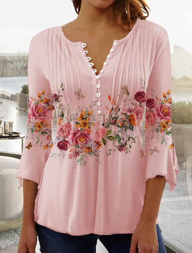 Elegante blouse met knopen en geborduurde bloemen op de voorkant