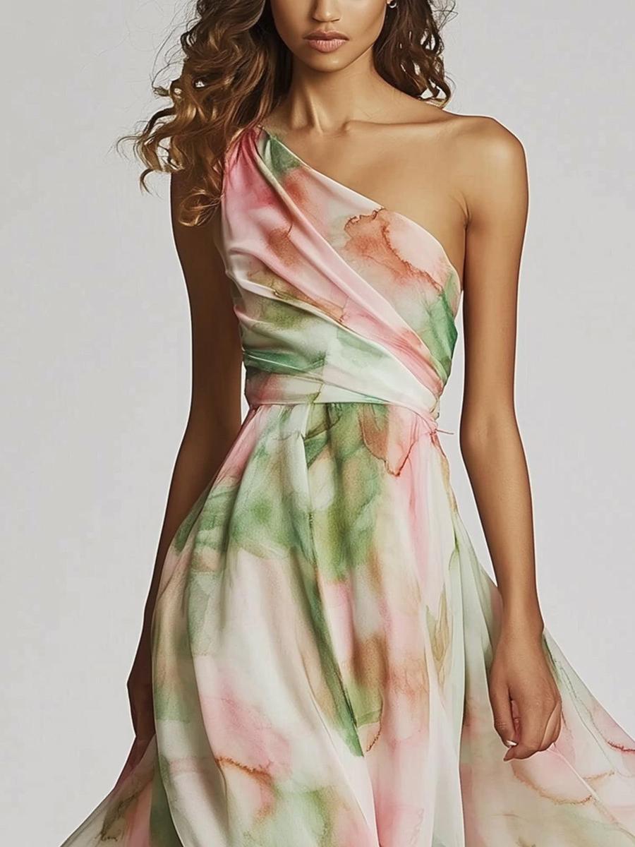 Zomerse maxi jurk met speelse print en asymmetrische schouderlijn