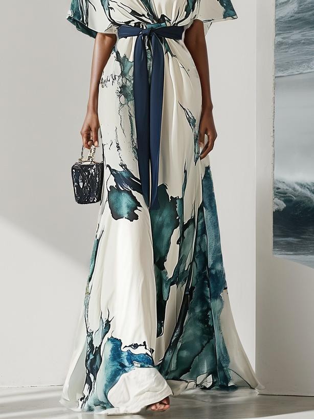 Elegante maxi-jurk met korte wijde mouwen en strikdetail in de taille voor een verfijnde uitstraling