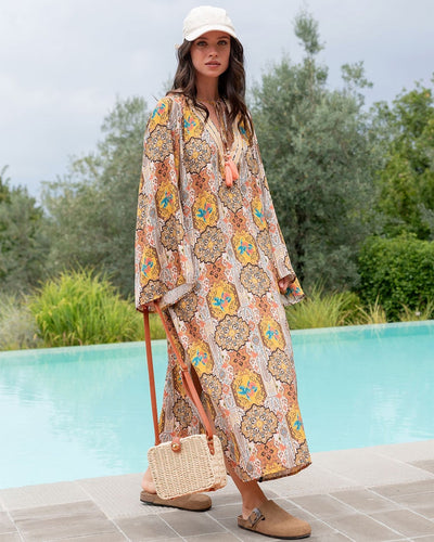 Zomerse lange tuniekjurk met V-hals en lange mouwen met print