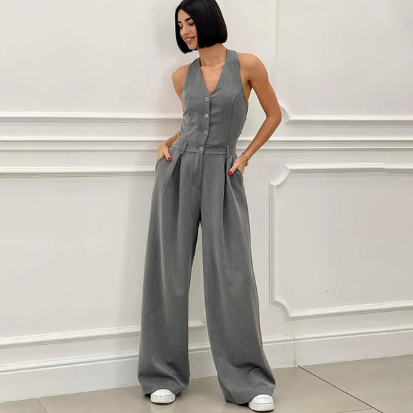 Mouwloze dames jumpsuit met halternek wijde pijpen en knopen aan de voorkant