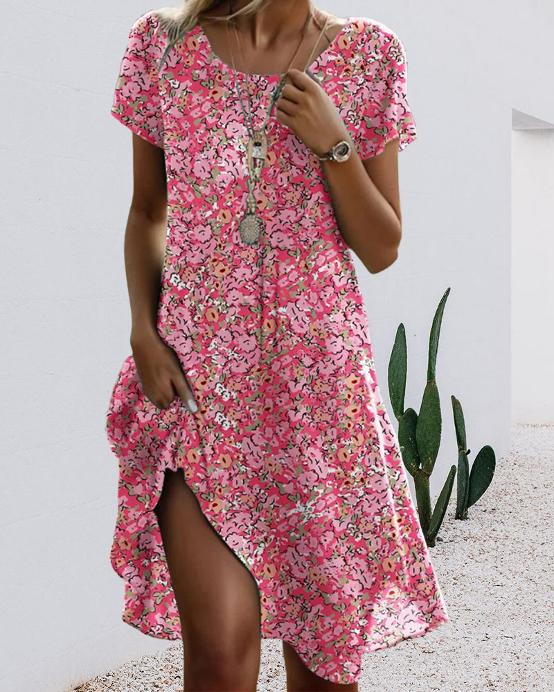 Zomerse midi jurk met korte mouwtjes en bloemenprint