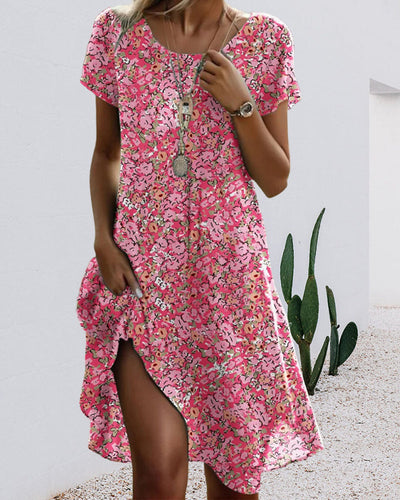 Zomerse midi jurk met korte mouwtjes en bloemenprint