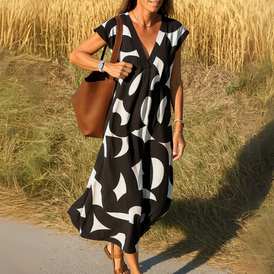 Elegante maxi jurk met korte mouwen en geometrisch patroon