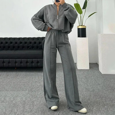 Nonchalant dames trainingspak met ritssluiting en high-waist uitlopende broek