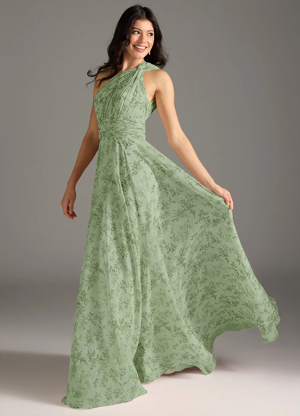 Elegante lange damesjurk met asymmetrische halslijn en bloemendessin