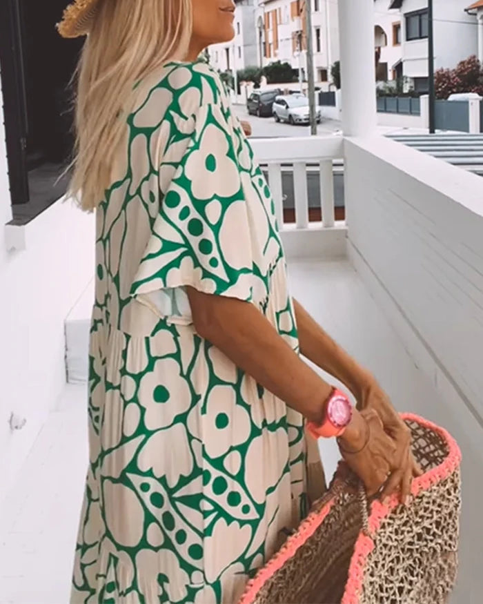 Lange zomerjurk met bloemenprint en losse pasvorm