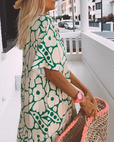 Lange zomerjurk met bloemenprint en losse pasvorm