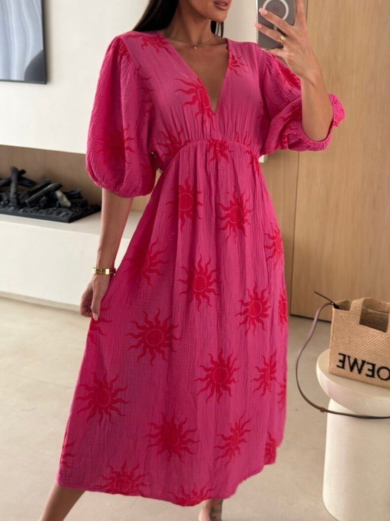 Luchtige zomer maxi jurk met korte mouwen en speelse print