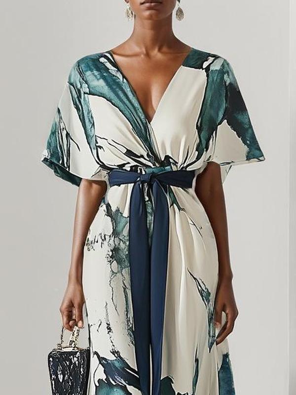 Elegante maxi-jurk met korte wijde mouwen en strikdetail in de taille voor een verfijnde uitstraling