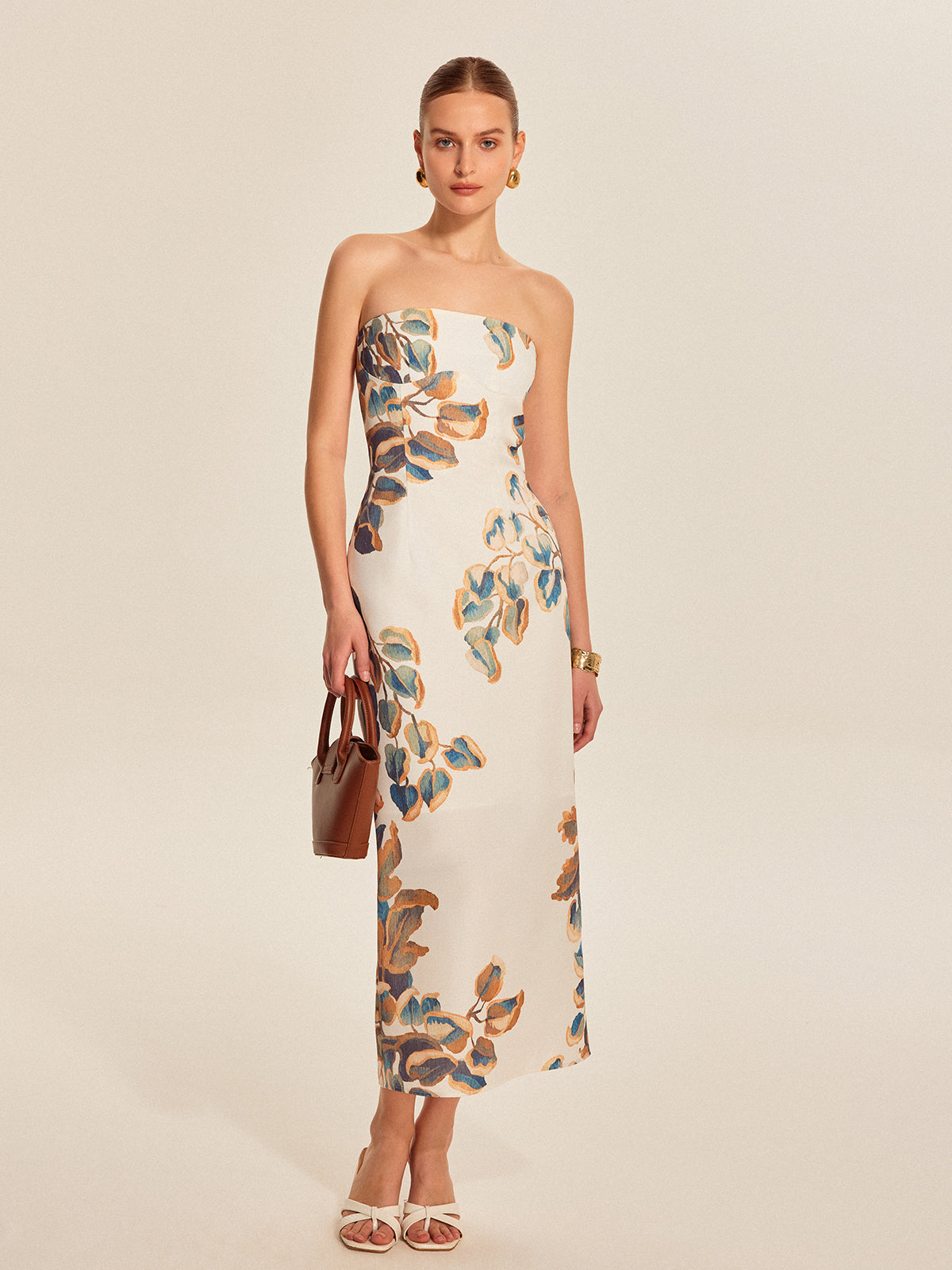 Elegante strapless jurk met bloemenmotief en verfijnde uitstraling