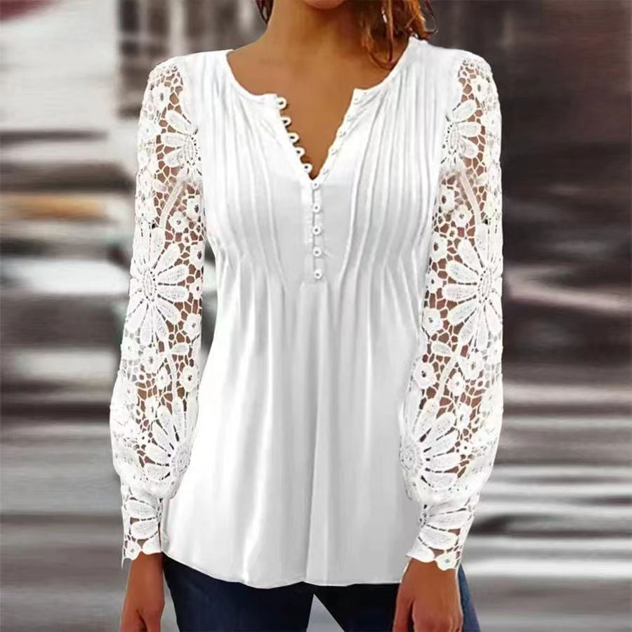 Elegante blouse met knopen en geborduurde bloemen op de voorkant