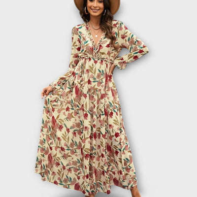Elegante lange damesjurk met bloemenmotief en lange mouwen voor een luchtige stijl