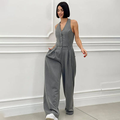 Mouwloze dames jumpsuit met halternek wijde pijpen en knopen aan de voorkant