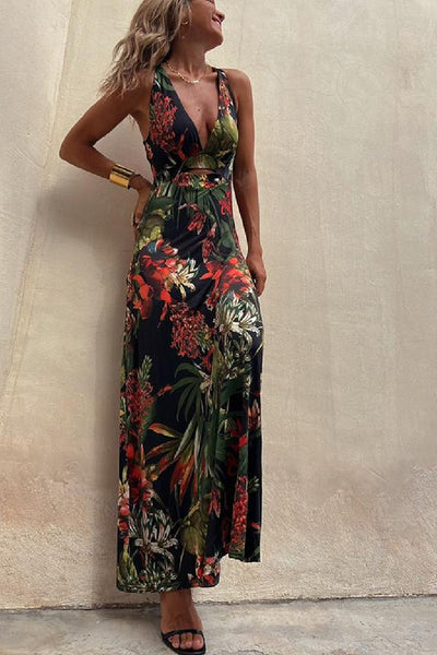 Lange crossover jurk met tropische print en open rug perfect voor zomerse gelegenheden