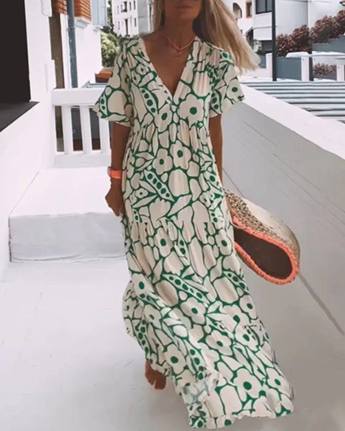 Lange zomerjurk met bloemenprint en losse pasvorm