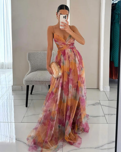Elegante maxi jurk met dunne bandjes en artistiek bloemenmotief