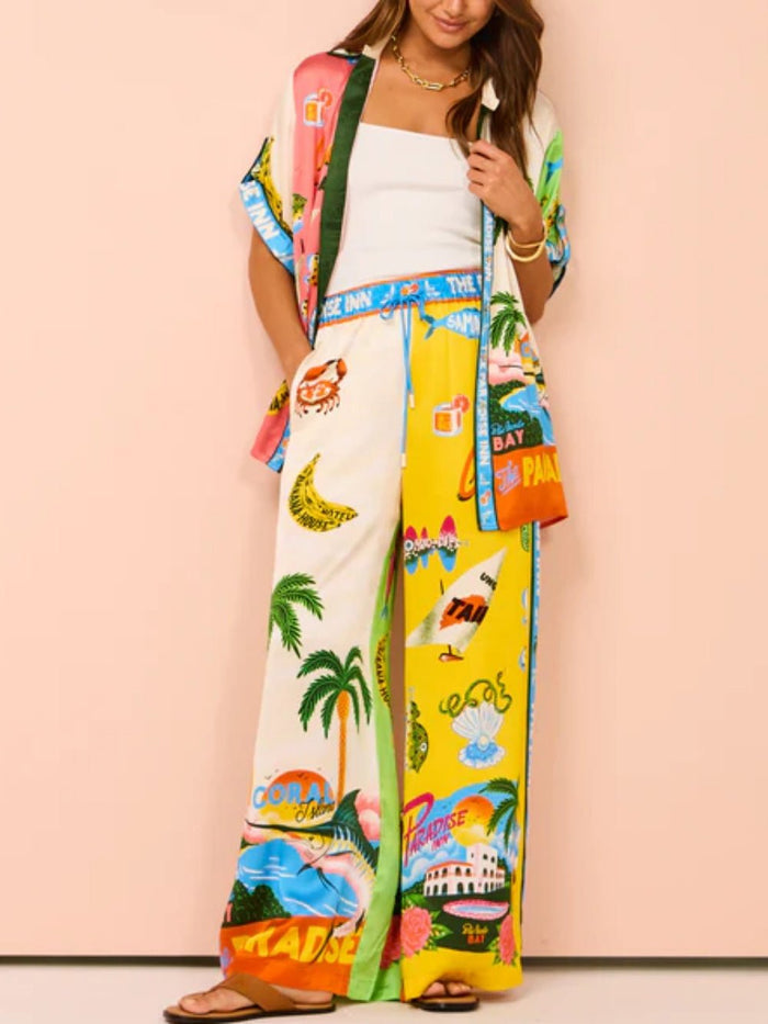 Tweedelige zomerset met wijde blouse en broek met strandprint
