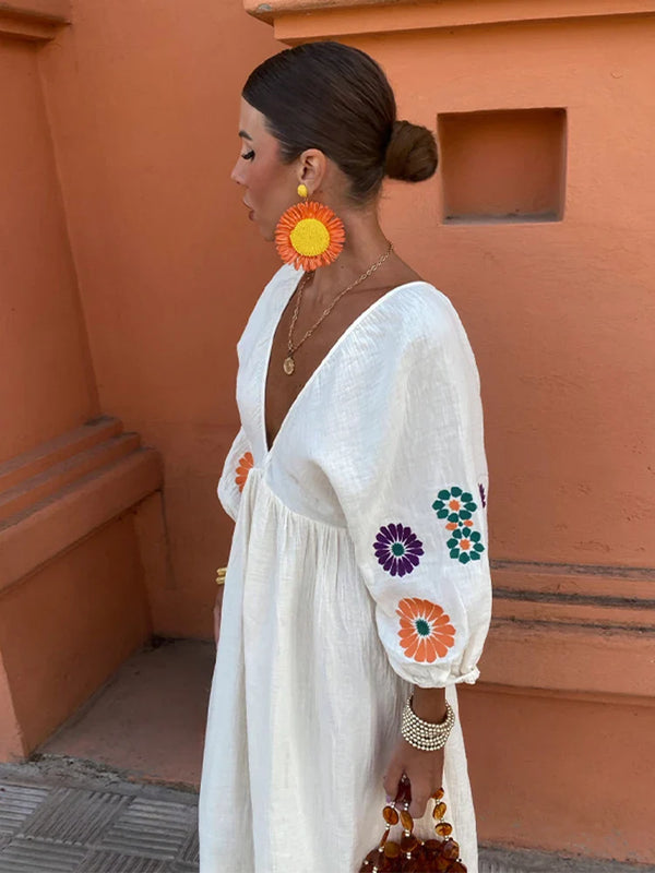 Lange zomerse damesjurk met elegante pofmouwen