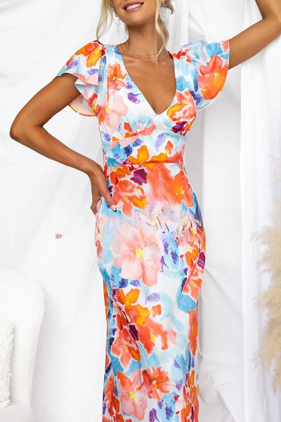 Lange jurk met bloemenprint en korte mouwen perfect voor feestdagen en stijlvolle momenten
