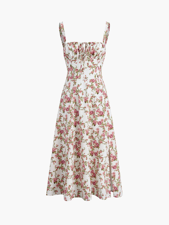 Zomerse midi jurk met bloemenpatroon en fijne schouderbandjes