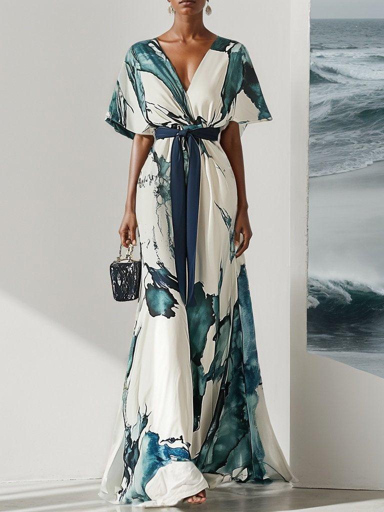 Elegante maxi-jurk met korte wijde mouwen en strikdetail in de taille voor een verfijnde uitstraling