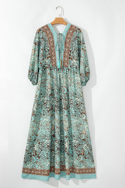 Lange boho-jurk met bloemenprint, open rug en hoge taille