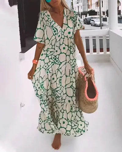 Lange zomerjurk met bloemenprint en losse pasvorm