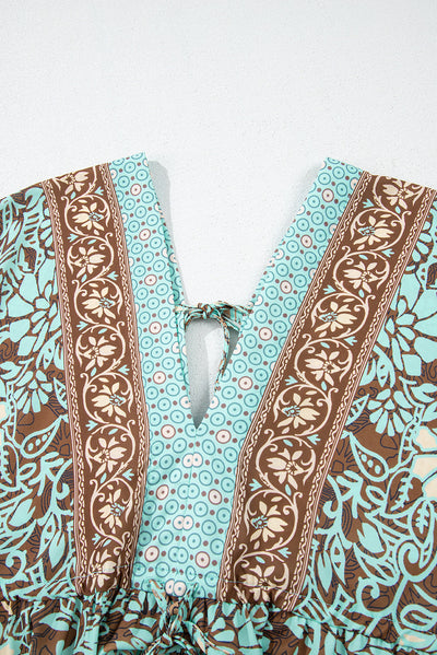 Lange boho-jurk met bloemenprint, open rug en hoge taille