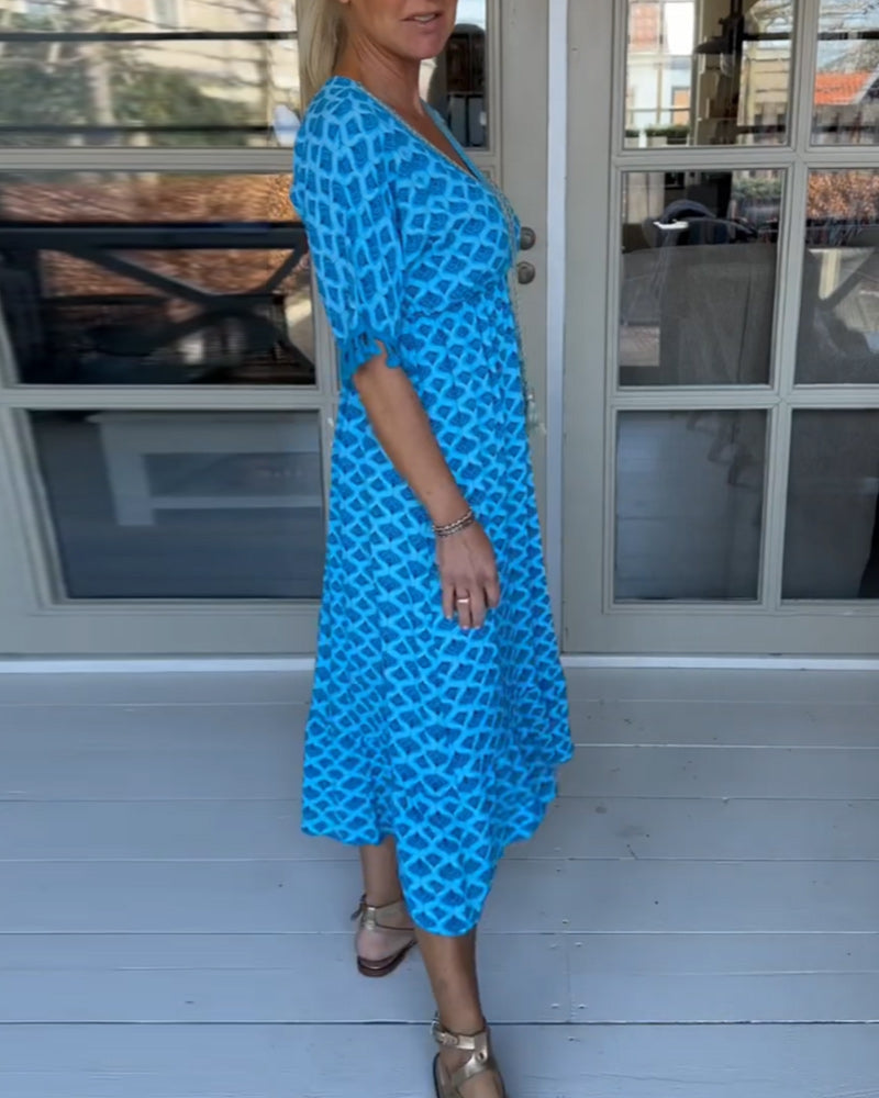 Luchtige maxi jurk met V-hals en speels patroon voor een relaxte stijl