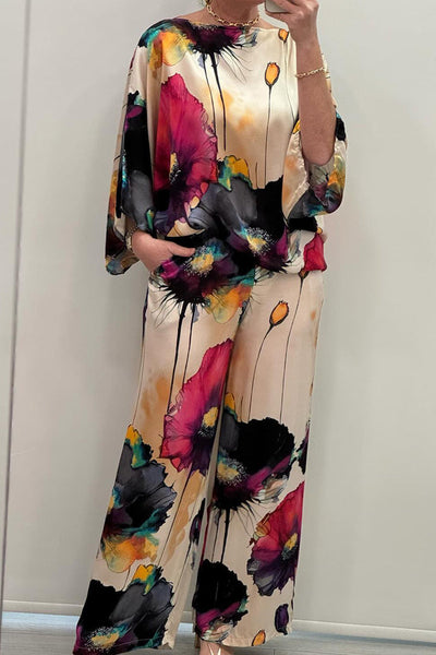Elegante dames set met wijde blouse en bijpassende broek voor een stijlvolle uitstraling