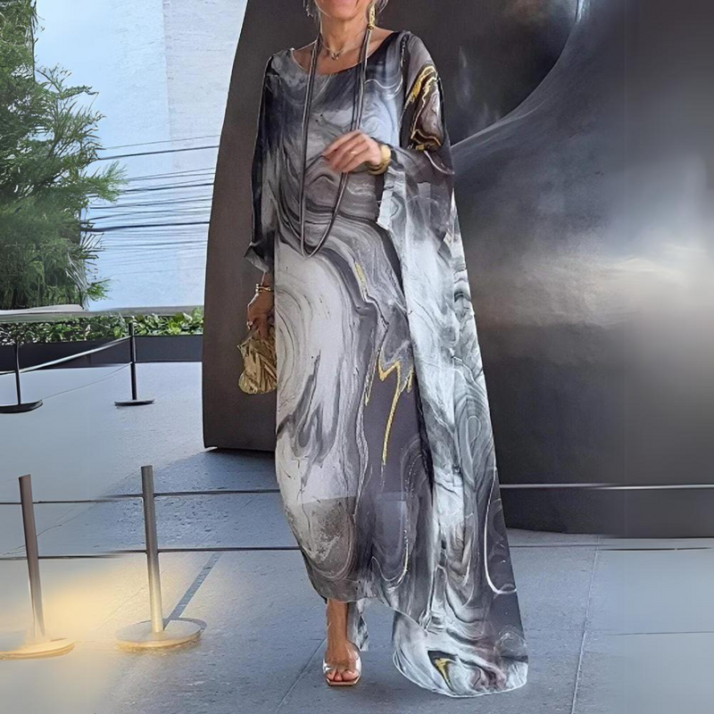 Lange elegante jurk met wijde mouwen en sierlijk patroon